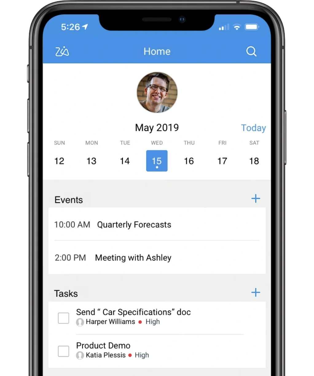 A close-up of a smartphone showcasing an app interface with a calendar view highlighting May 15, 2019, followed by "Events" like "Quarterly Forecasts" and "Meeting with Ashley," and "Tasks" including "Send 'Car Specifications' doc" and "Product Demo." A profile picture of a person is visible at the top.