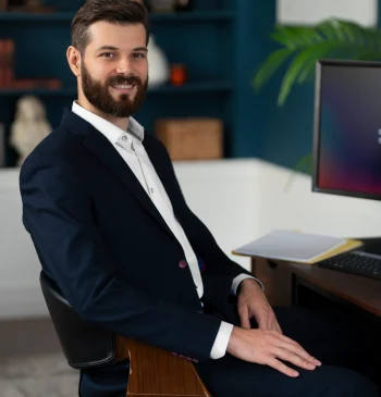 side-view-smiley-man-sitting-desk side-view-smiley-man-sitting-desk