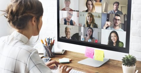 People in a virtual meeting using Zoho Meeting on laptop